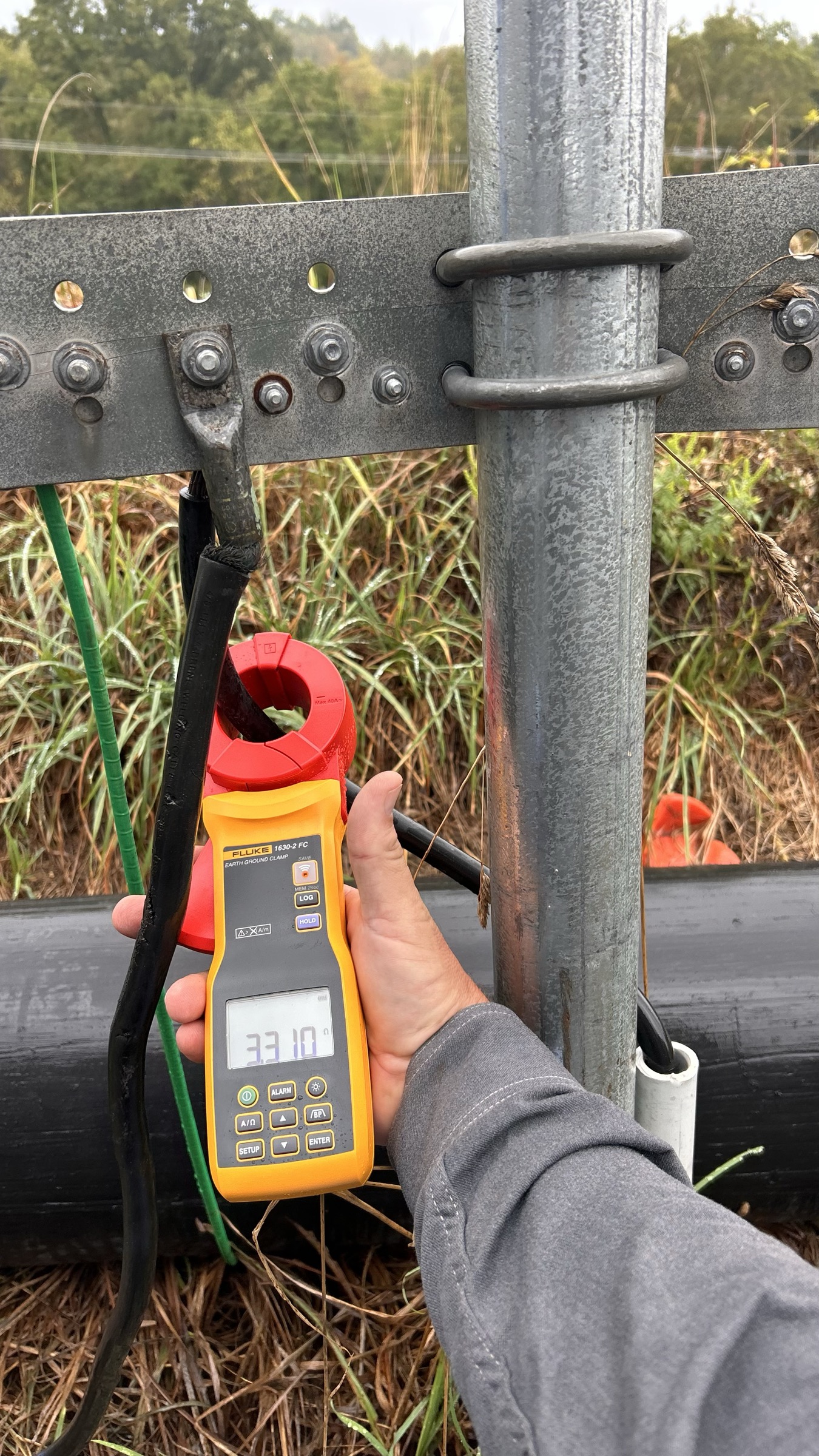 Rig ACE technician measuring current in the field
